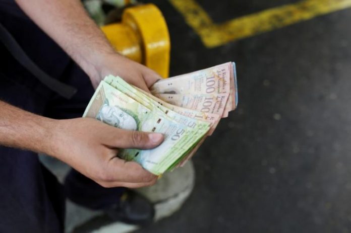 Venezuela's Maduro raises wages as protests continue