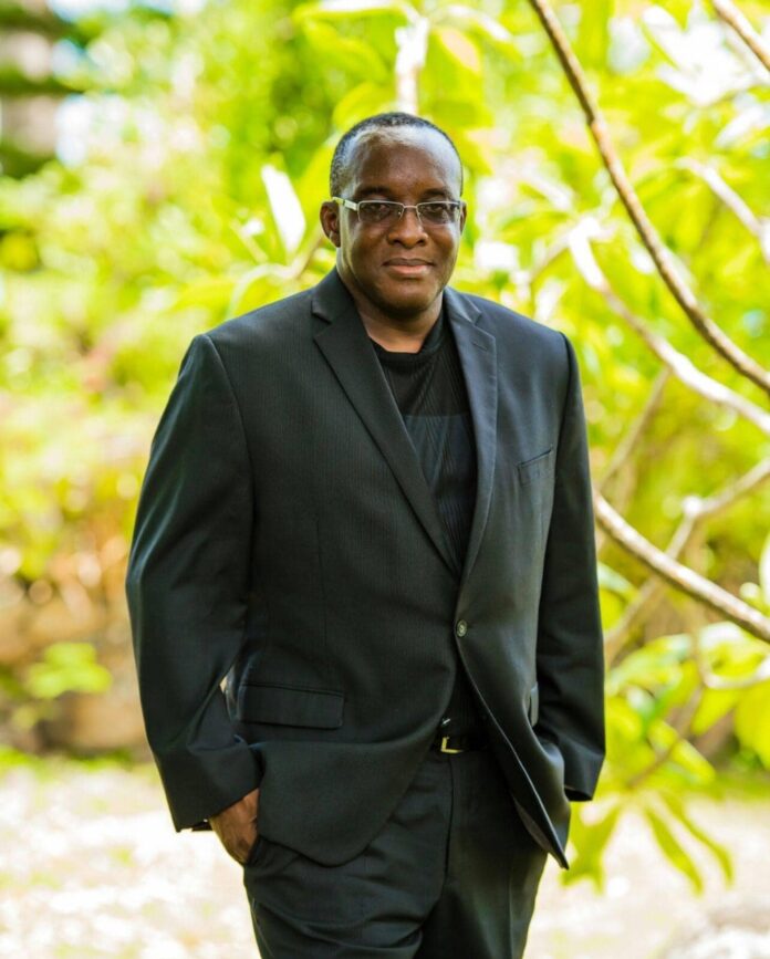 Premier Mark Brantley congratulates Oscar Astro Brown: Nevis's Cayson King